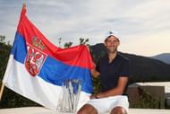 Novak Djokovic with the Serbian flag after winning the 2016 BNP Paribas Open in California